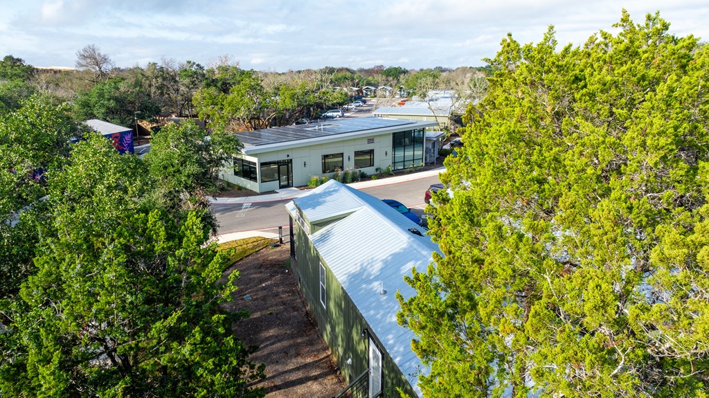 a view of a building from above with trees