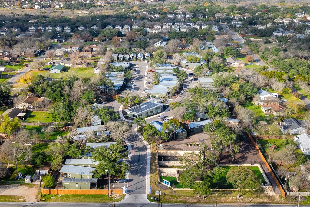 an aerial view of a neighborhood with houses and trees
