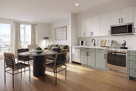 a kitchen and dining room with a table and chairs