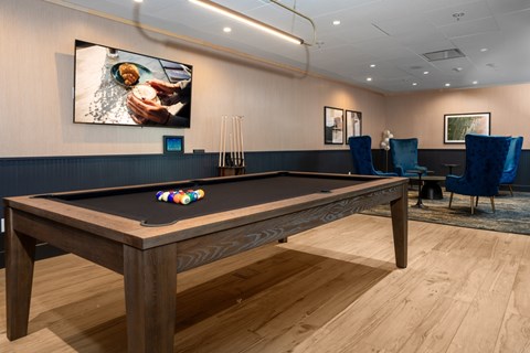 A pool table with a billiard ball on it.