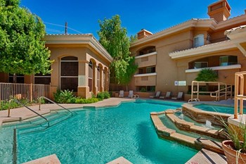 Apartments for Rent Old Town Scottsdale AZ - Cibola - Pool Area with Jacuzzi, Lounge Chairs, and Planters - Photo Gallery 4