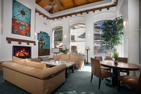 A living room with a fireplace and a couch.