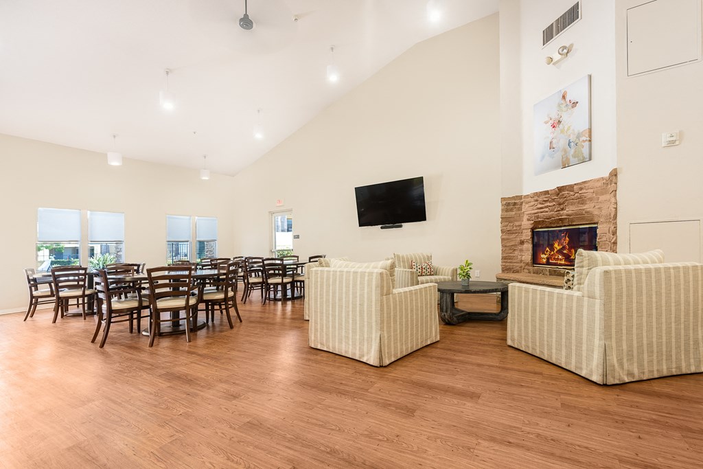 clubhouse with wood flooring and a fireplace at 55+ FountainGlen Temecula, Temecula, CA, 92591