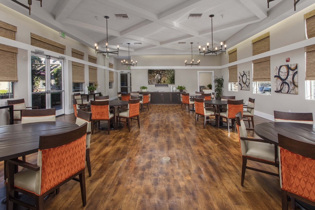 a large room with hardwood floors and white walls at 55+ Remington at Ladera Ranch, California, 92694