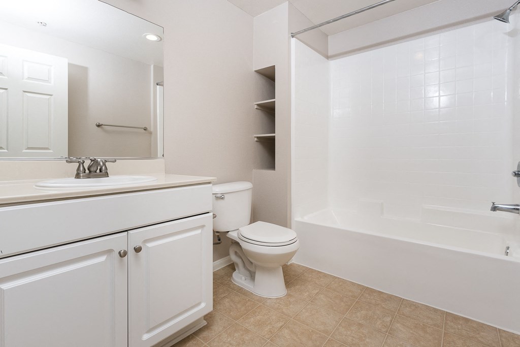 a bathroom with a bathtub toilet and sink