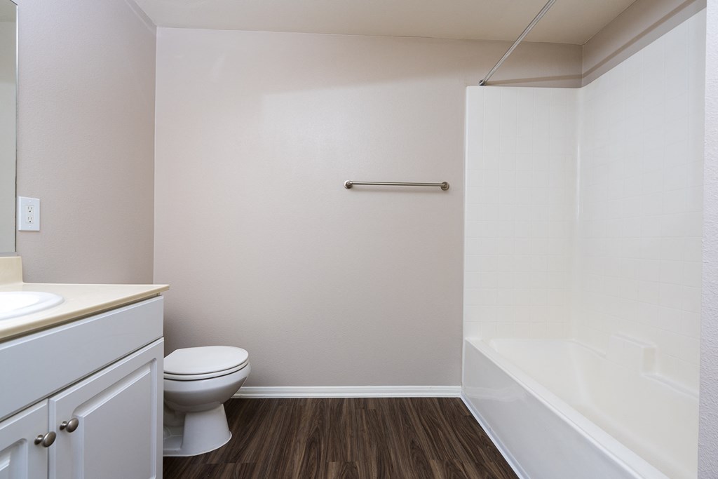 a bathroom with a toilet sink and bathtub