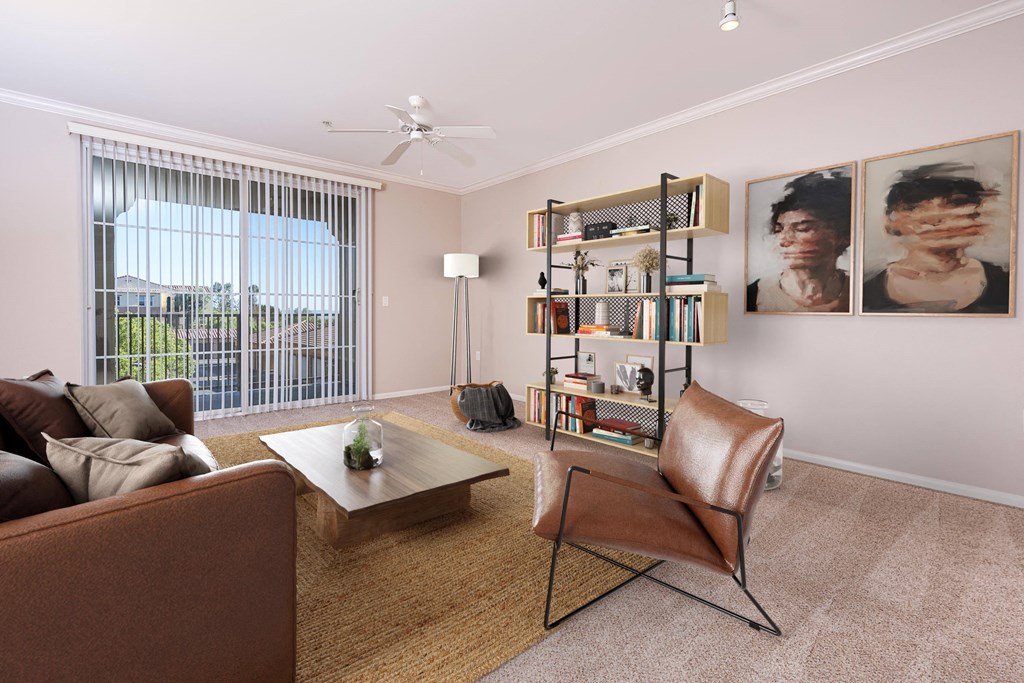 a living room with pink walls and a large window