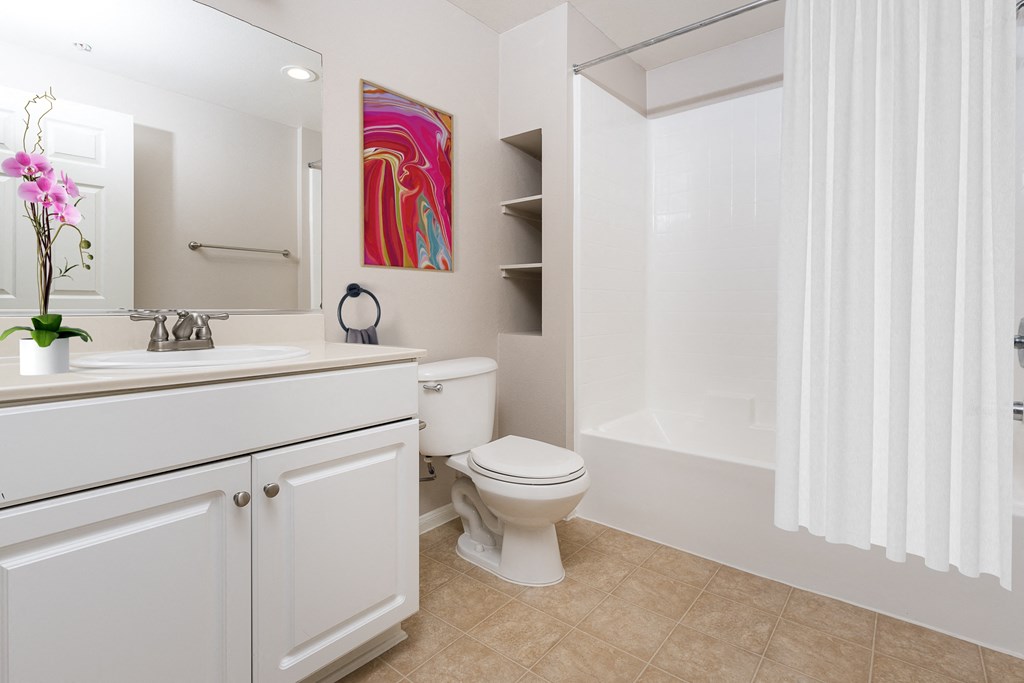 a bathroom with a toilet sink and bathtub