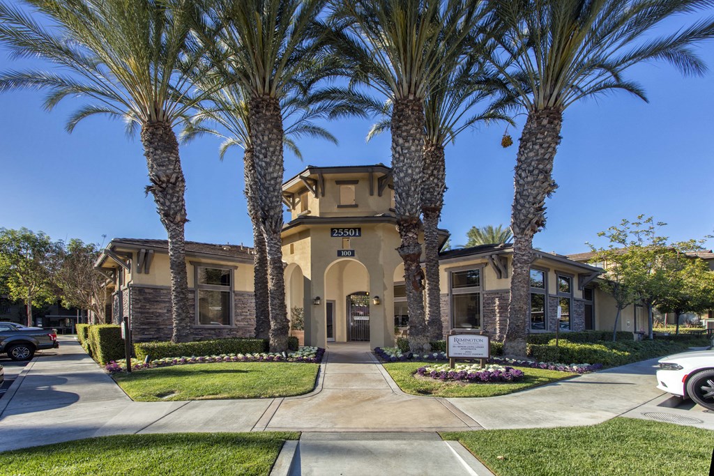 a home with palm trees in front of it at 55+ Remington at Ladera Ranch, California, 92694