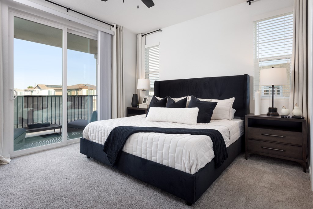 a bedroom with a bed and two nightstands