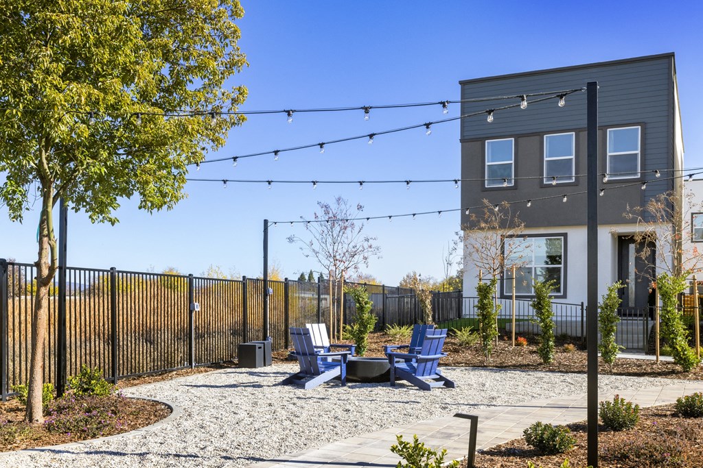 the preserve at ballantyne commons courtyard with chairs and tables and a building