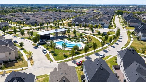 A residential area with houses and a swimming pool.