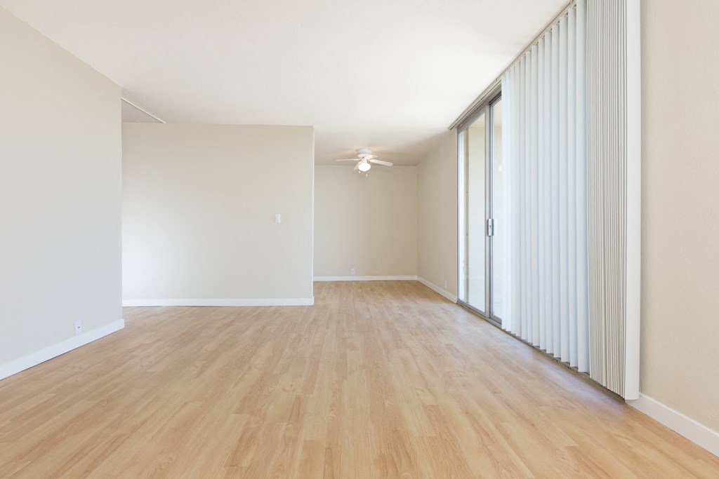 edgewood unfurnished living room with wood plank style flooring at Avenue Two Apartments, Redwood City  , California