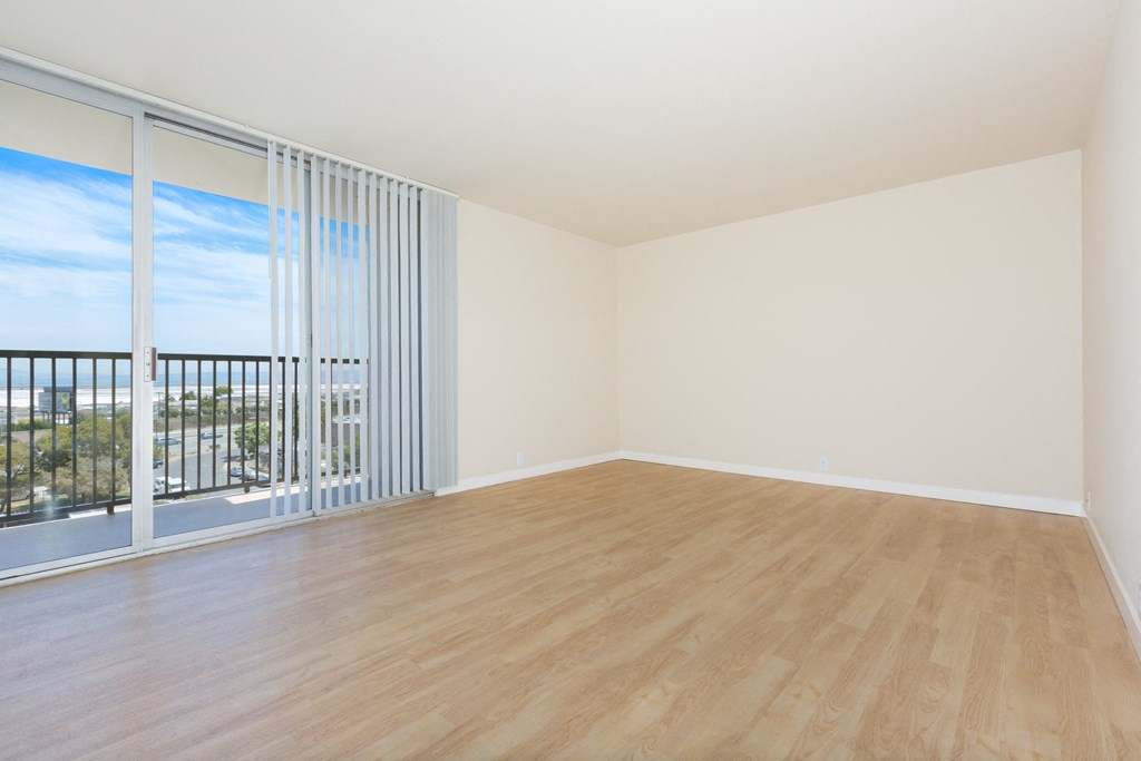 edgewood unfurnished living room with wood plank style flooring at Avenue Two Apartments, Redwood City  , CA 