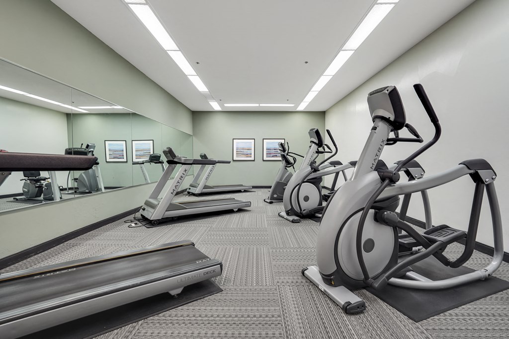 Fitness center at Americana Apartments, California