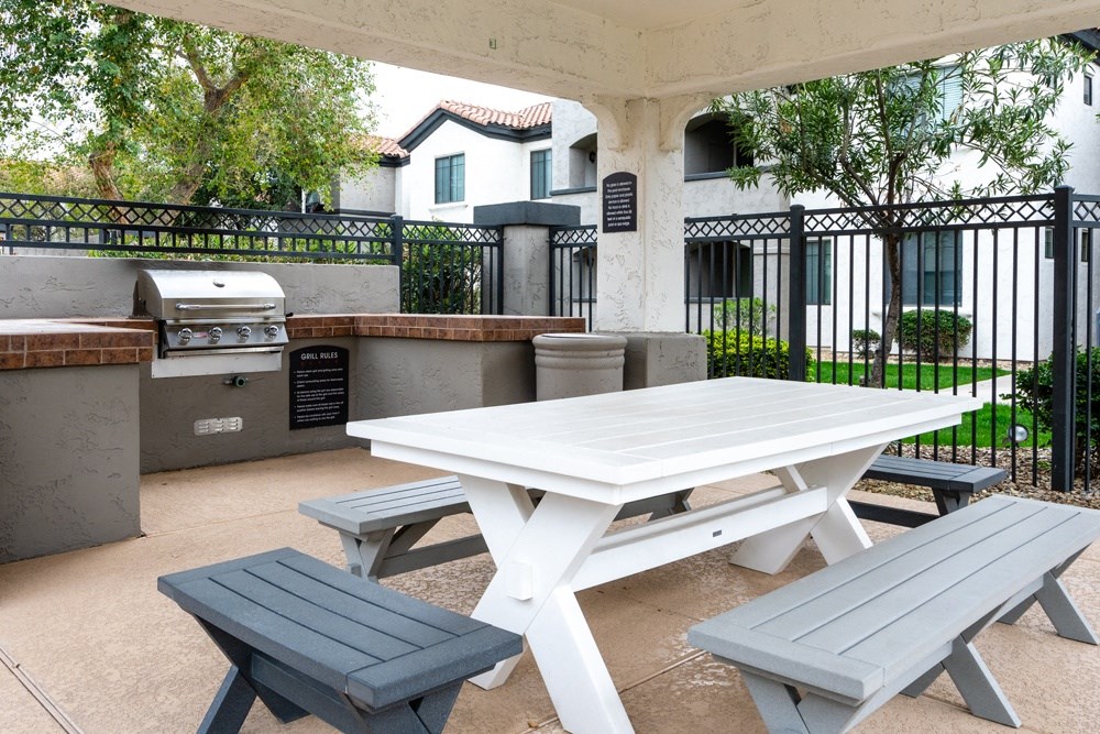 Pic nick table with benches and a grill