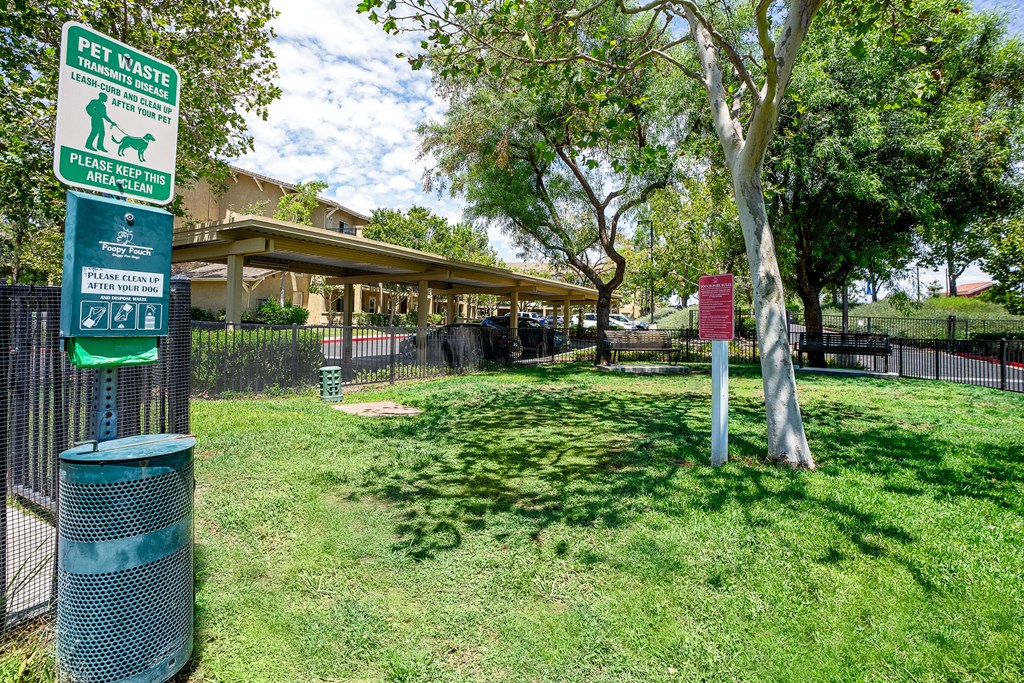 a grassy area  dog park with trees at 55+ FountainGlen Temecula, Temecula, California