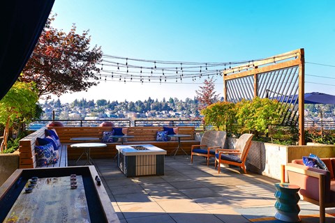 Rooftop terrace with fire pit and scenic city views at Eastlake 2851 Apartments, Washington