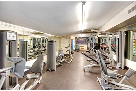 Fitness room with resistance machines and free weights at Eastlake 2851 Apartments, Seattle, 98102