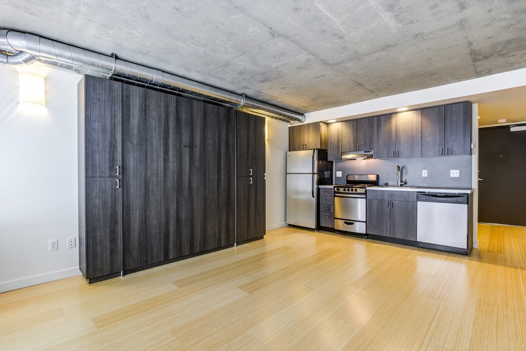 Studio layout with kitchen with stainless steel appliances