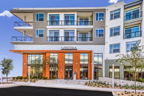 A modern multi-story building with the name "MESTRA" on the front.