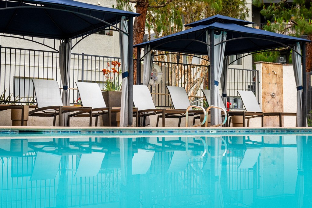 Pool, cabana and chaise lounge chairs at 55+ FountainGlen Goldenwest, Westminster, CA