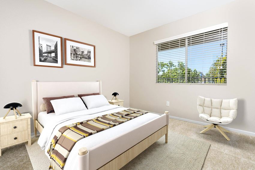 a FountainGlen Temecula bedroom with a bed and a chair - Photo Gallery