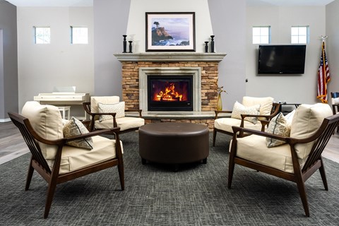 a room with furniture and a fireplace at 55+ FountainGlen Valencia, California, 91354