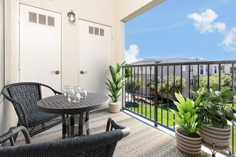 a patio with a table and chairs on a balcony at 55+ FountainGlen Valencia, California