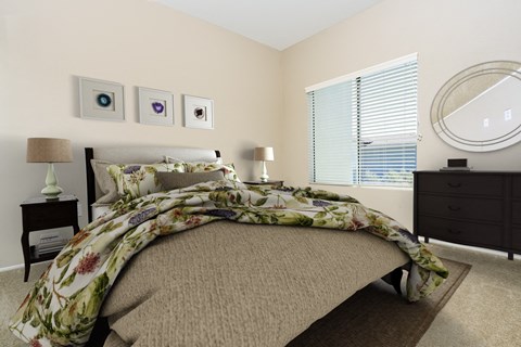 a bedroom with a bed and a dresser and a window at 55+ FountainGlen Valencia, California, 91354