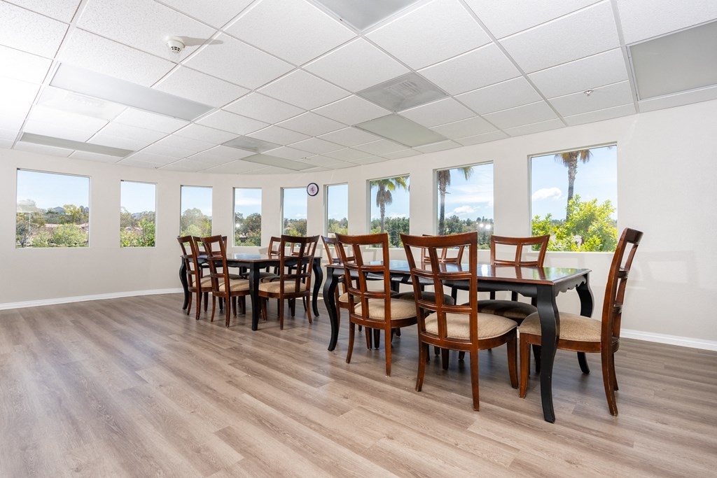 community clubhouse with table and chairs community clubhouse with table and chairs at 55+ FountainGlen Valencia, Valencia, California