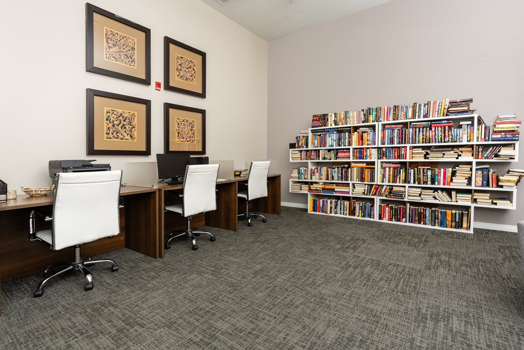 a library with desks and chairs and bookshelves