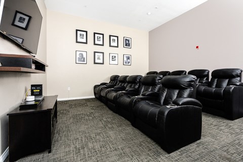 theater room with tv and leather chairs at 55+ FountainGlen Valencia, Valencia, California