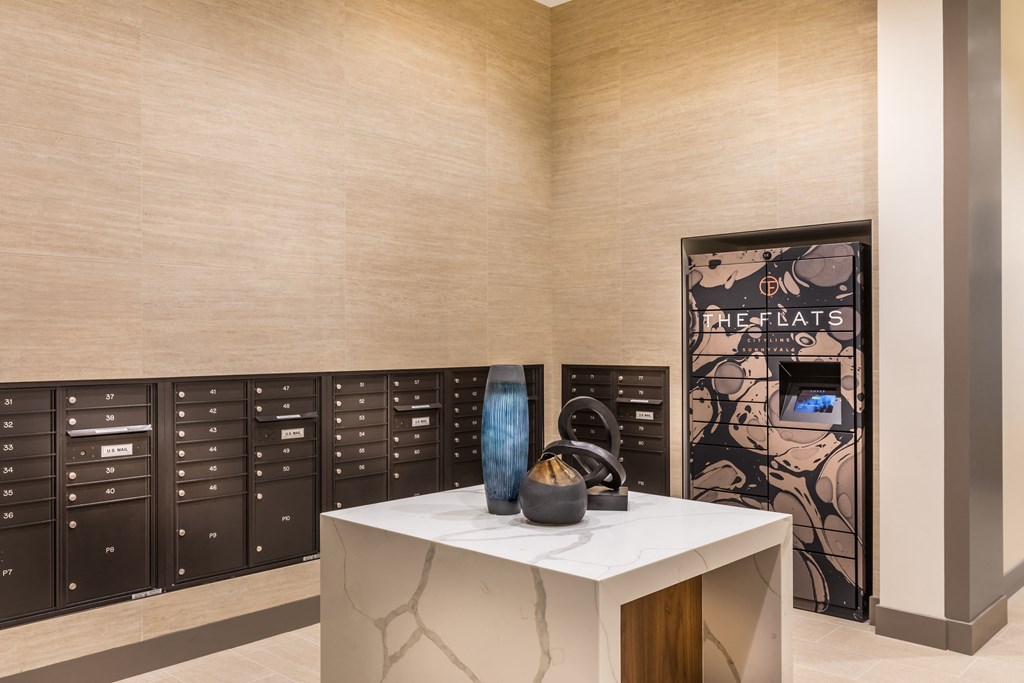 a counter with a vase in a room with lockers