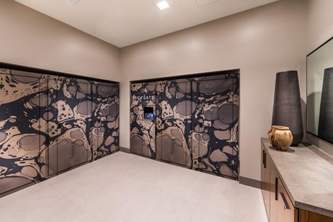 a room with two vases and a wall with a pattern on it