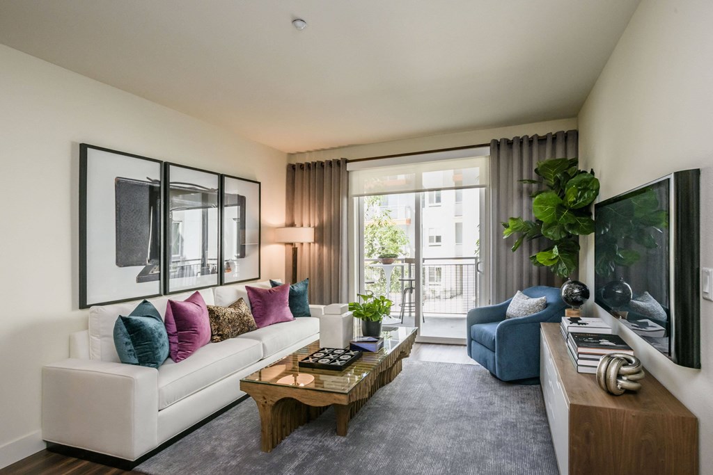 a living room with a white couch and a coffee table