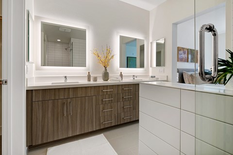 the preserve at ballantyne commons community bathroom with double sinks and mirrors