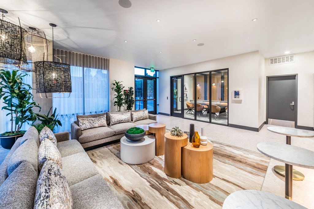 a living room with couches and tables