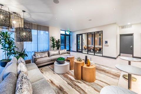 a living room with couches and tables