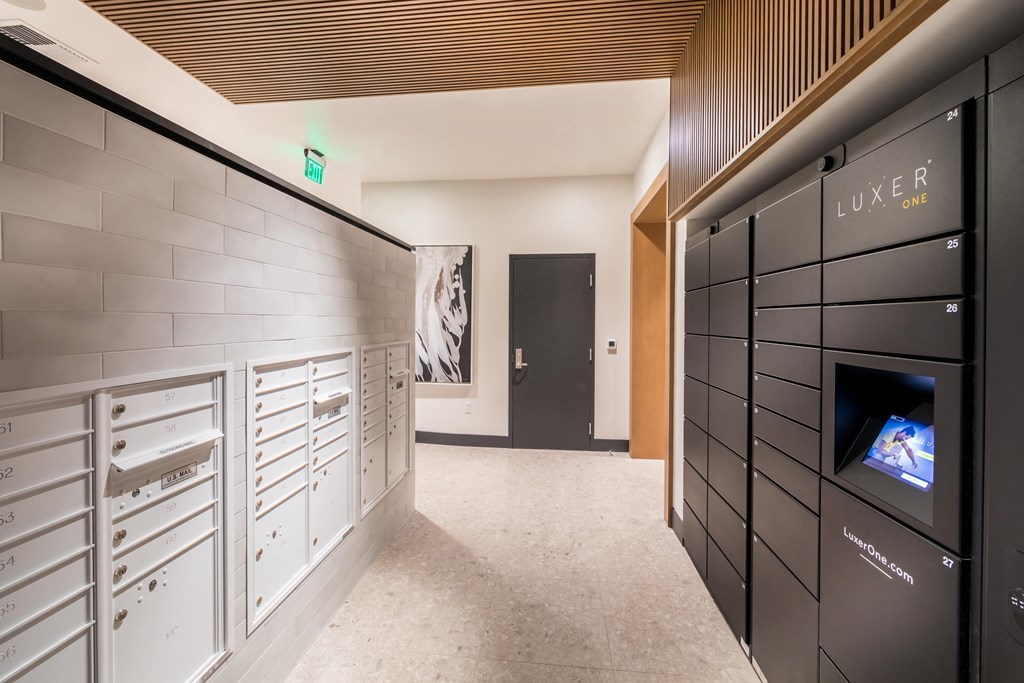 the laundry room has plenty of cabinets and a television