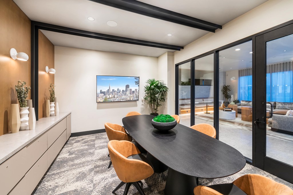 a dining room with a table and chairs