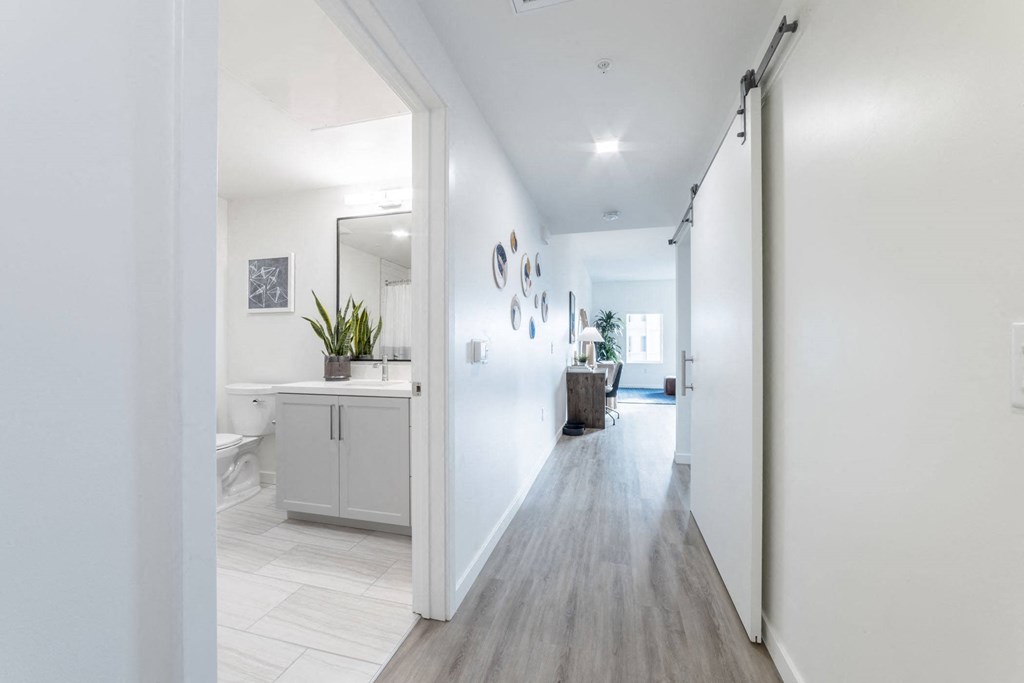 Hallway with view into bathroom