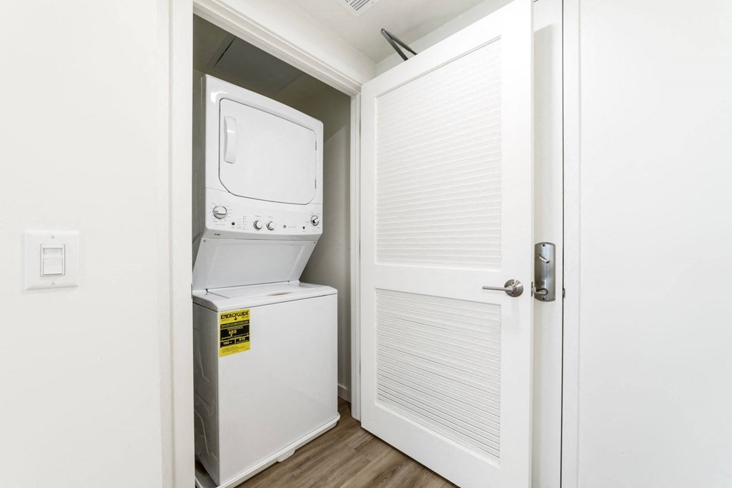 laundry closet with a washer and dryer in it