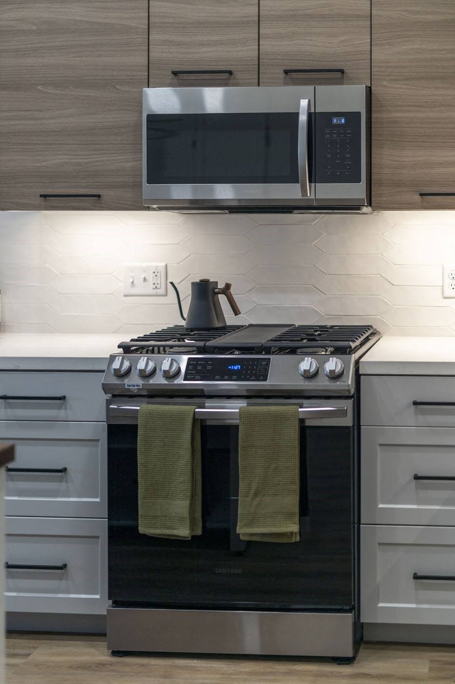 Stainless steel appliances with kettle on top of stove