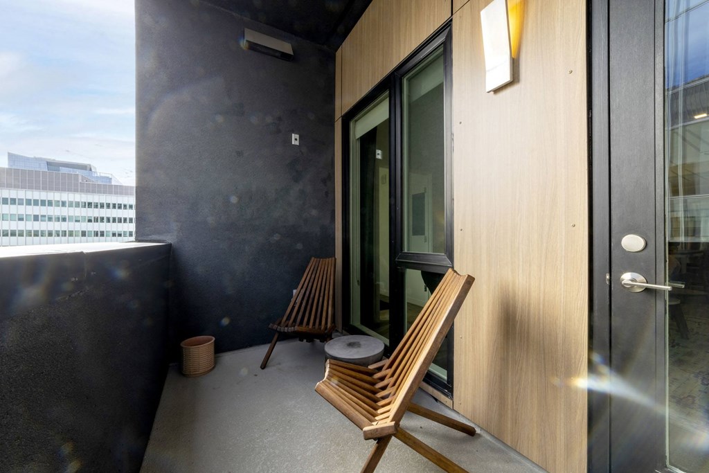 Balcony with two wooden chairs