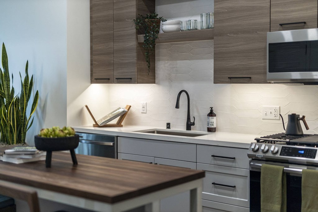 a kitchen with a counter top and a sink
