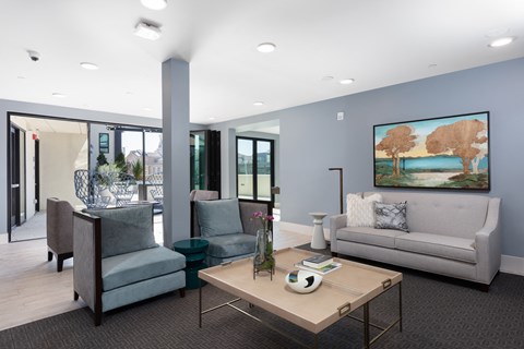 a living room with couches and chairs and a table