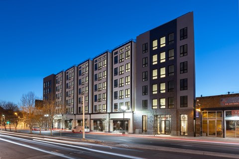 a large building on a city street at night