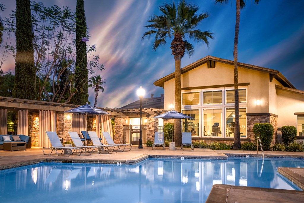 Pool in front of house at The Grove Apartments, California, 91761