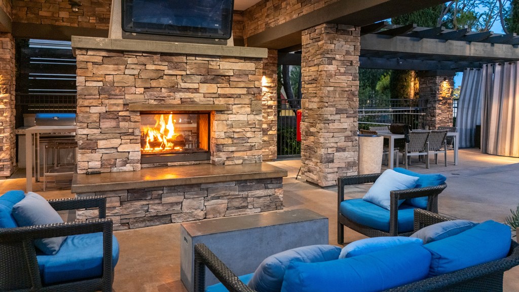 Stone fireplace at The Grove Apartments, California